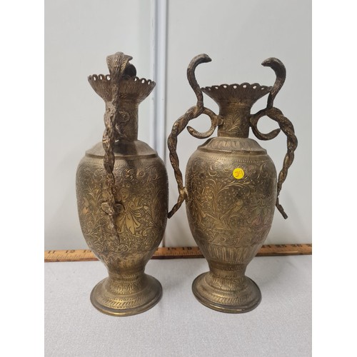 11 - Pair of Indian brass cobra handled vases.
27cm h