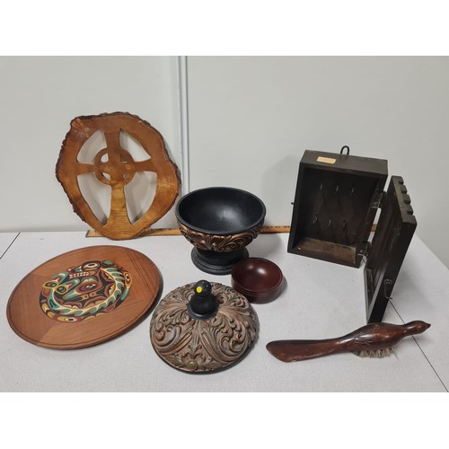 136 - Collection of treen items to include intricately carved lidded bowl.