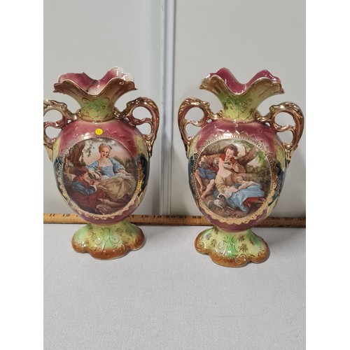 179 - Pair of Victorian twin handled vases depicting scenes of lovers. One has been repaired. Marked to th... 