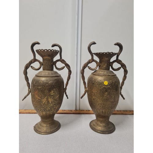 11 - Pair of Indian brass cobra handled vases.
27cm h