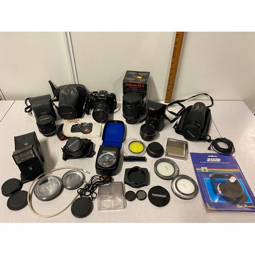 23 - Qty of photography equipment to include Pentax camera, selection of lenses, Lunasix light meter and ... 