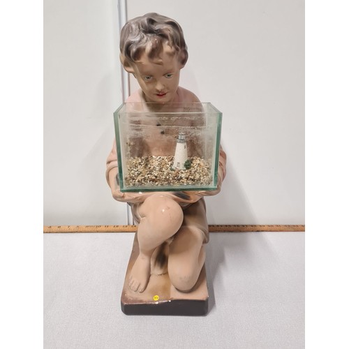 38 - Art Deco 1930's advertising shop display chalk ware plaster boy with fish tank.
53cm h