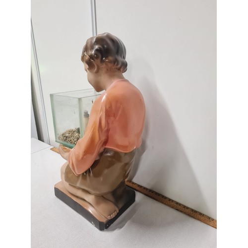 38 - Art Deco 1930's advertising shop display chalk ware plaster boy with fish tank.
53cm h