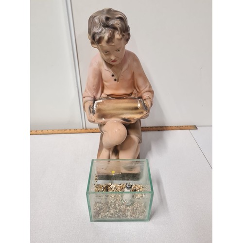 38 - Art Deco 1930's advertising shop display chalk ware plaster boy with fish tank.
53cm h