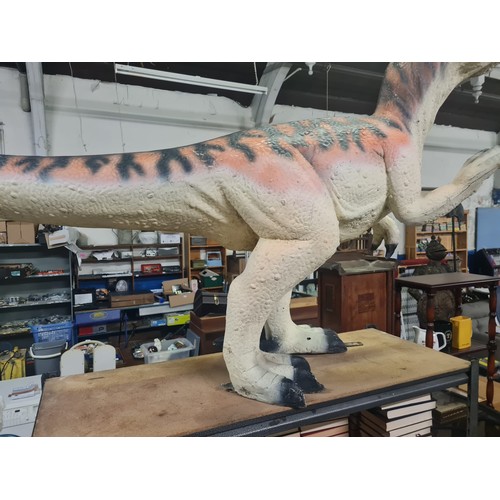 64 - Dinosaur model made from poly-resin and fibreglass orange and black stripe. Size approx. 208cm x 106... 