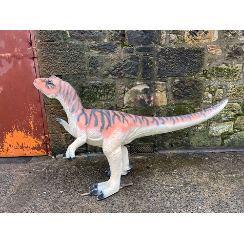 64 - Dinosaur model made from poly-resin and fibreglass orange and black stripe. Size approx. 208cm x 106... 