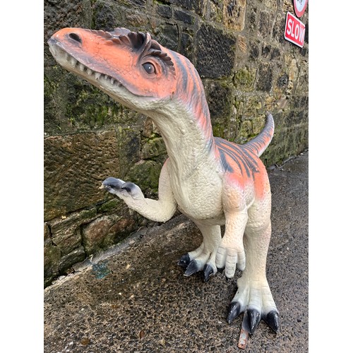 64 - Dinosaur model made from poly-resin and fibreglass orange and black stripe. Size approx. 208cm x 106... 