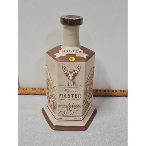 54 - R. Carmichael and Sons Supreme Master Scotch whisky aged 28 years in ceramic decanter. Full and seal... 