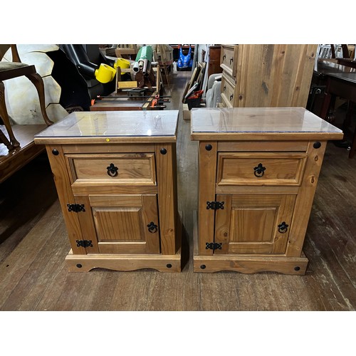 57 - Pair of Mexican pine bedside cabinets with glass tops.