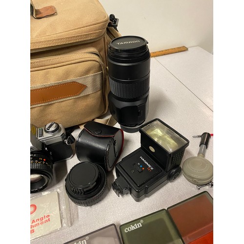 281 - Minolta camera, lenses to include Tamron etc. and Cokin cromofilters and carry case.