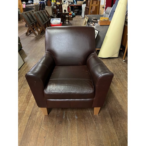 377 - Brown leather arm chair.