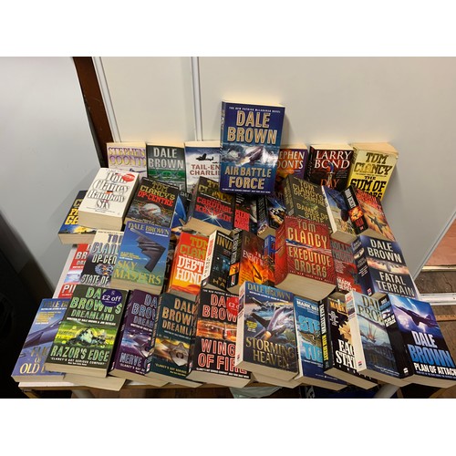 418 - Large collection of military novels to include Tom Clancy and Dale Brown.