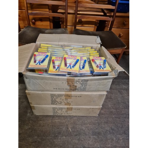 497 - 3 boxes of 48 glitter glue sticks.