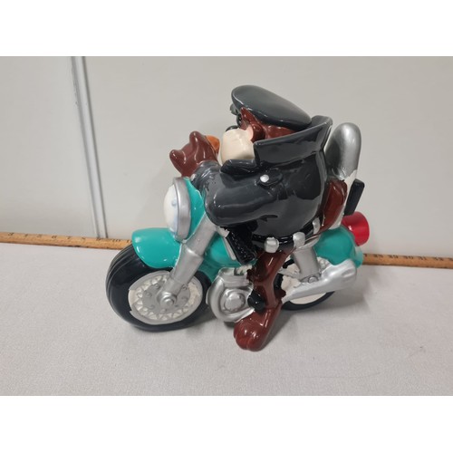 126 - Taz on motorbike Warner Bros. cookie jar.
28cm h x 34cm w