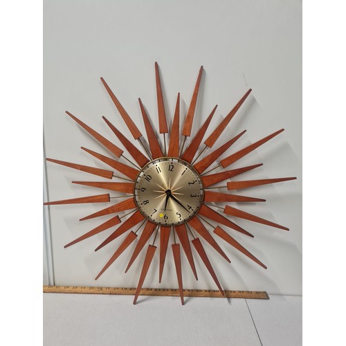 51 - Newgate teak sunburst wall clock, working.
68cm