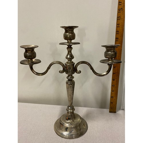 284 - Pair of plated candelabras.