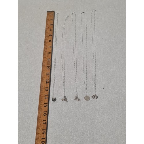 57 - 5 silver chain & pendants