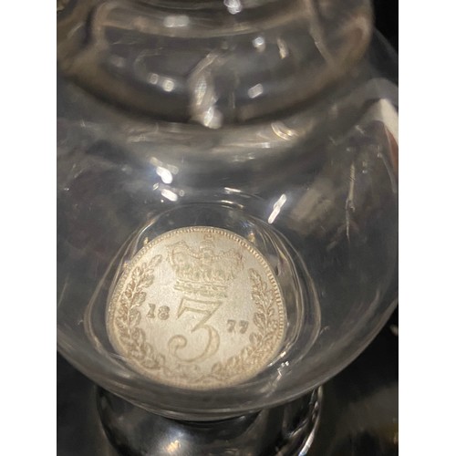 134 - Victorian coin glass dated 1889, 
Hollow knopped with silver threepence dated 1877.
approx 20cm h
Gl... 