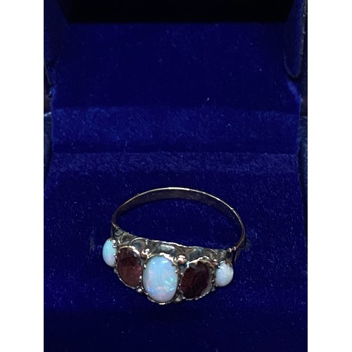 83 - Vintage 9ct gold dress ring with opals and rubies.