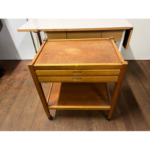 175 - Mid century teak trolley with 2 folding tray tables.
83cm w x 70cm h x 43cm d