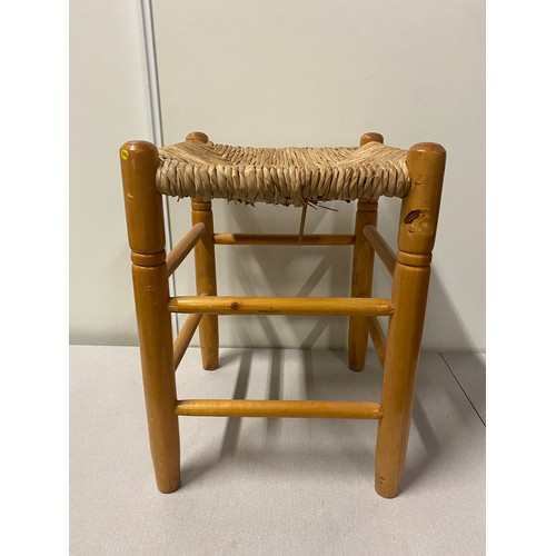 570 - Vintage pine stool with wicker seat.