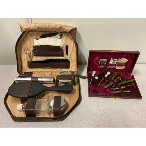 303 - Vintage cased vanity set along with sewing kit.