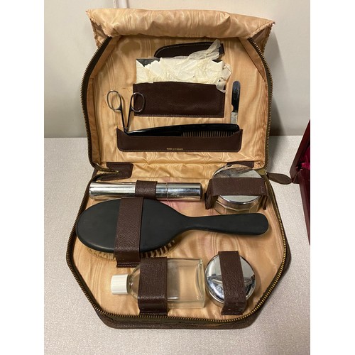 303 - Vintage cased vanity set along with sewing kit.