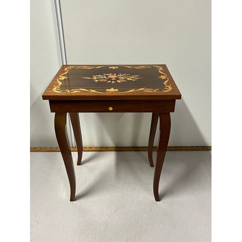 115 - Inlaid musical storage table. working.
43cm h