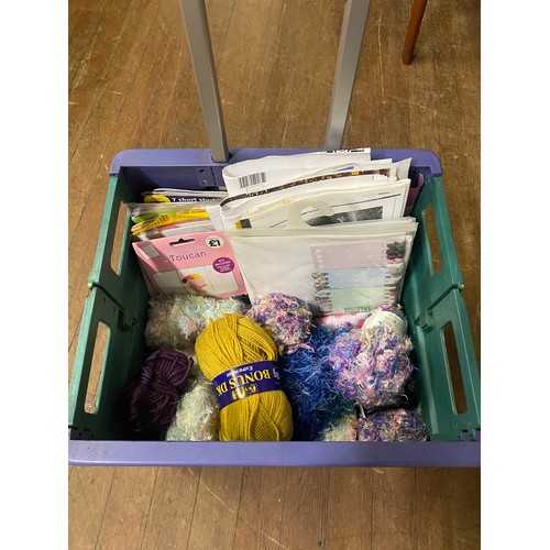 549 - Selection of wool and crafting magazines in collapsible trolley basket.