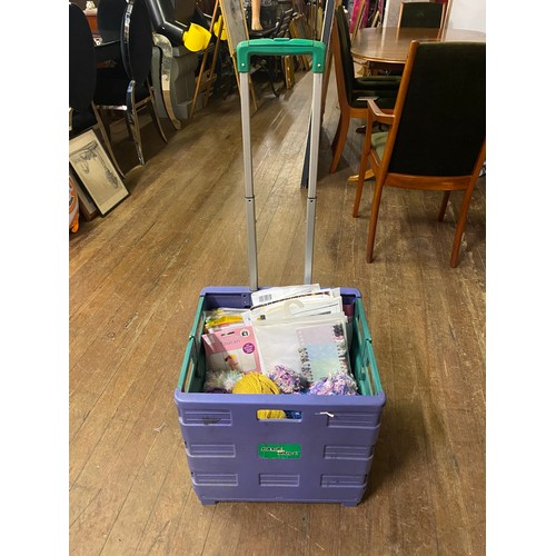 549 - Selection of wool and crafting magazines in collapsible trolley basket.