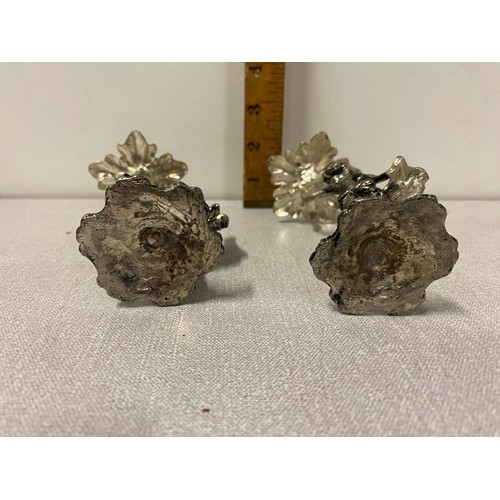 576 - Pair of small metal figurine candle sticks.