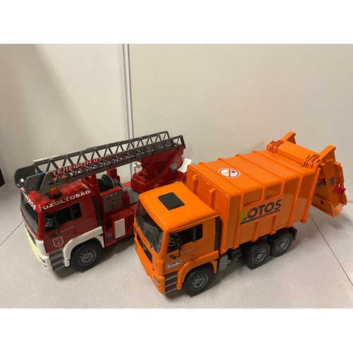 577 - Large toy fire truck and refuse truck.