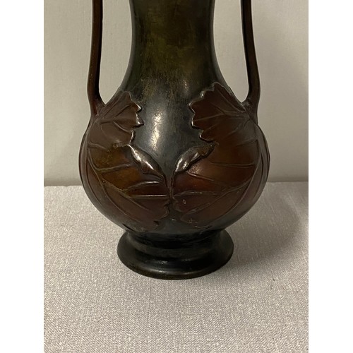 19 - Antique bronze Art Nouveau 2 handled vase. Decorated with leaf design. 
25.5cm tall.