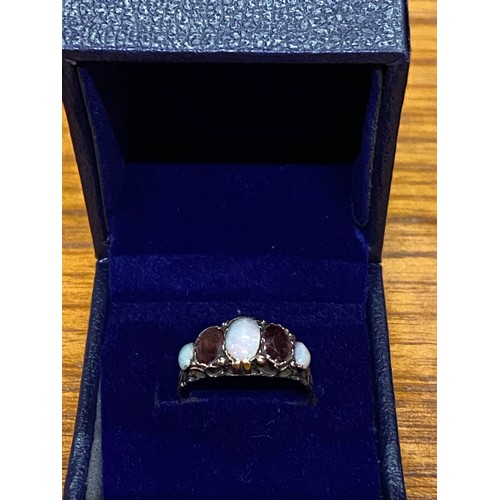 83 - Vintage 9ct gold dress ring with opals and rubies.1.8g