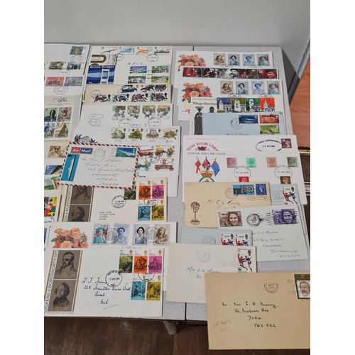 229 - Large collection of first day covers and stamp book.
(4)