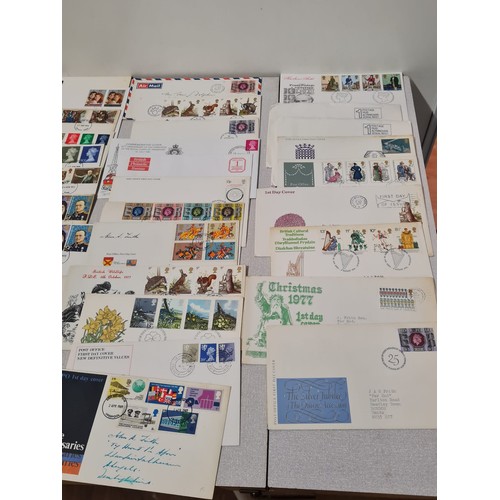 229 - Large collection of first day covers and stamp book.
(4)