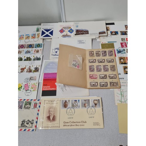 229 - Large collection of first day covers and stamp book.
(4)