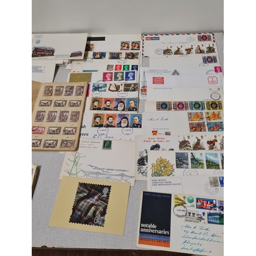 229 - Large collection of first day covers and stamp book.
(4)