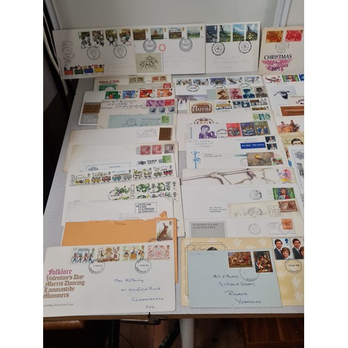 229 - Large collection of first day covers and stamp book.
(4)