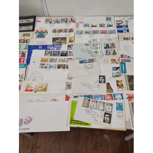 229 - Large collection of first day covers and stamp book.
(4)