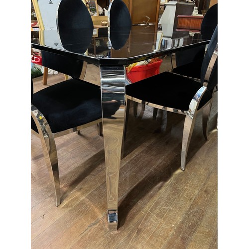 251 - Large black marble and chrome dining table with 6 matching chairs upholstered in black velvet.