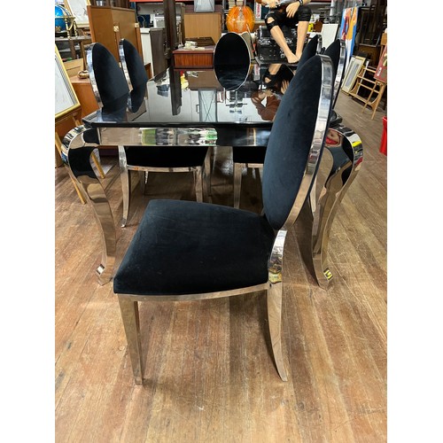 251 - Large black marble and chrome dining table with 6 matching chairs upholstered in black velvet.