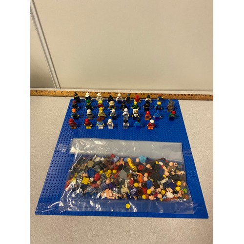 21 - Selection of Lego Men and bag of Lego man parts.