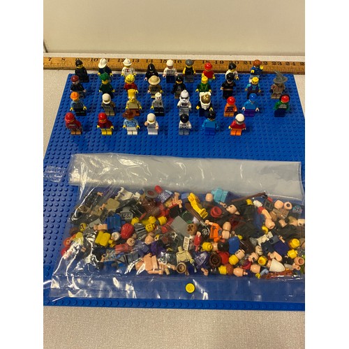 21 - Selection of Lego Men and bag of Lego man parts.