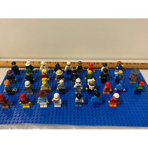 21 - Selection of Lego Men and bag of Lego man parts.