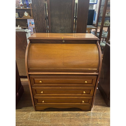 130 - Teak roll top desk with pull out desk and key.
103cm h x84cm w x 52cm d