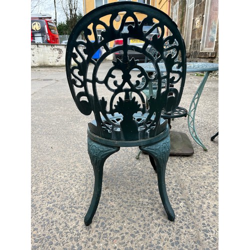 227 - Heavy cast iron 4 piece garden set - Table and 3 chairs. Comes with parasol holder.