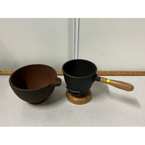 75 - 2 cast iron smelting pots.