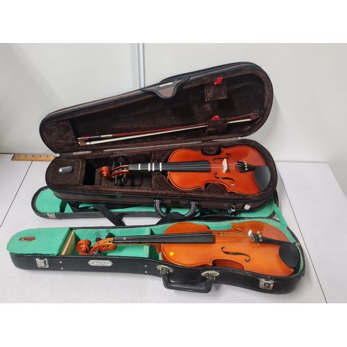 108 - 2 Sentor Student violins in cases.