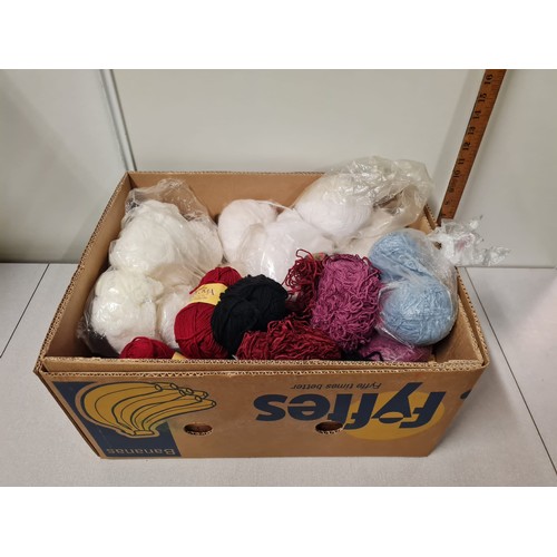 184 - Box of new wool.